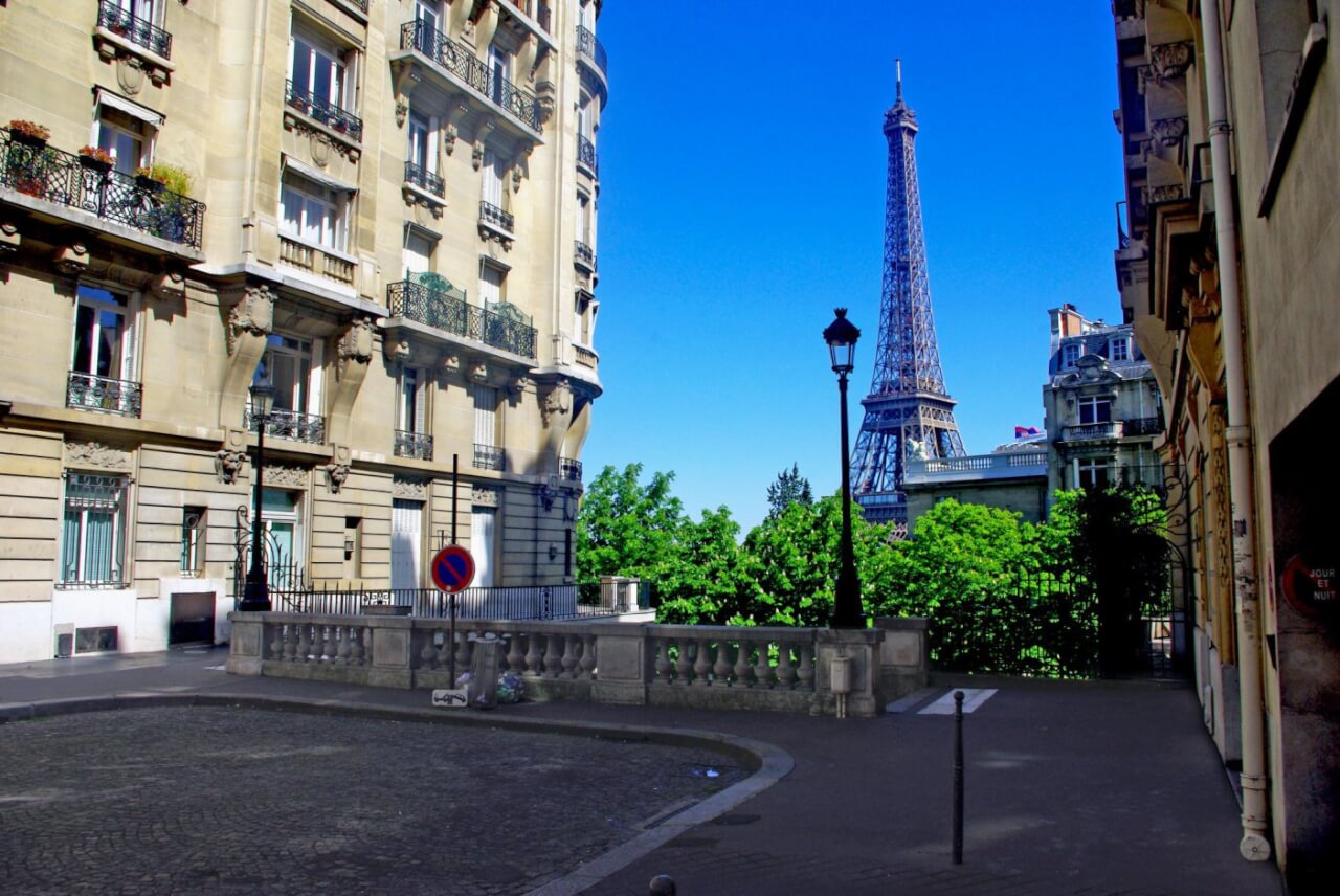 Eiffel Tower seen from a quiet Paris street