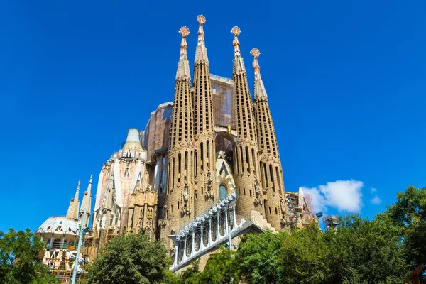Sagrada Família basilica in Barcelona against a blue sky